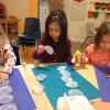Making a Snowman out of Cupcake Liners with the letters of our Name!